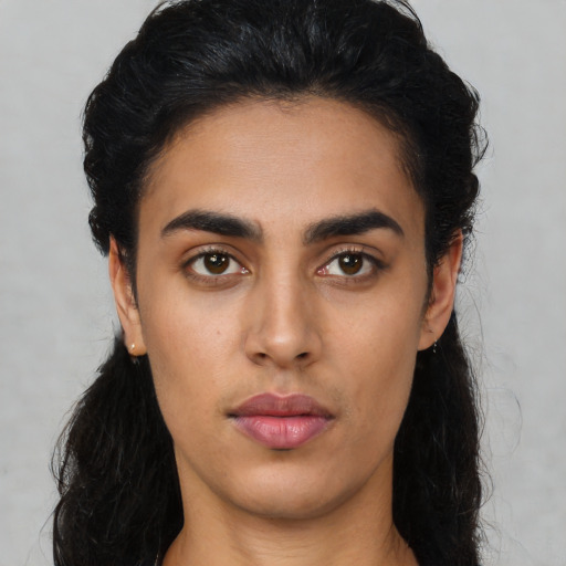 Neutral latino young-adult female with long  black hair and brown eyes