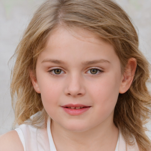 Joyful white child female with medium  brown hair and blue eyes