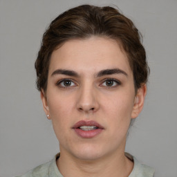 Neutral white young-adult female with short  brown hair and brown eyes