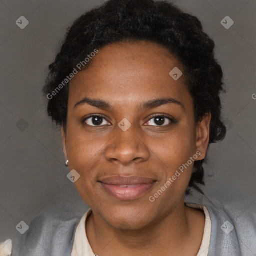 Joyful black adult female with short  black hair and brown eyes