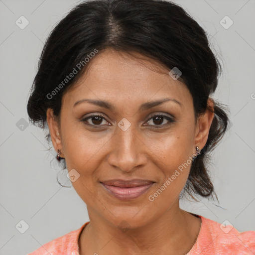 Joyful black adult female with medium  brown hair and brown eyes