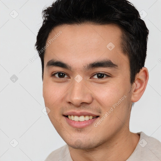 Joyful asian young-adult male with short  black hair and brown eyes