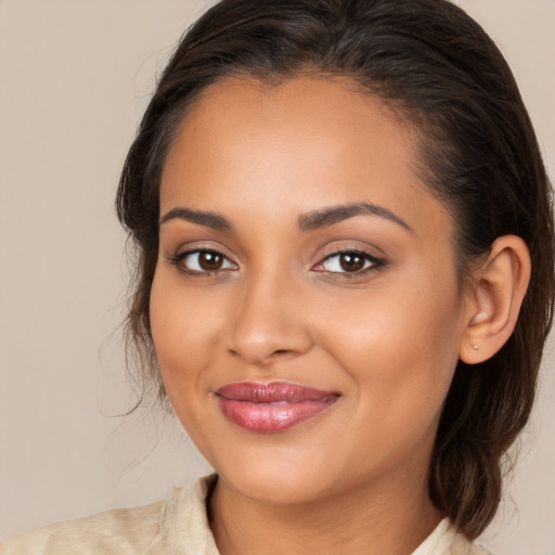 Joyful white young-adult female with long  brown hair and brown eyes