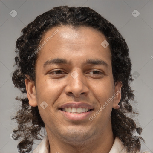 Joyful black adult male with medium  brown hair and brown eyes