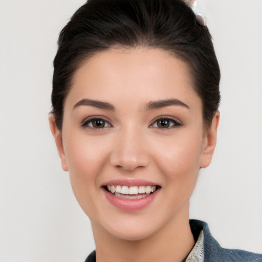 Joyful white young-adult female with medium  black hair and brown eyes