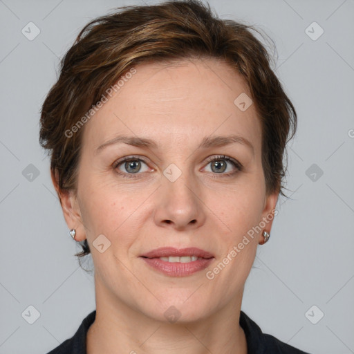 Joyful white adult female with medium  brown hair and grey eyes