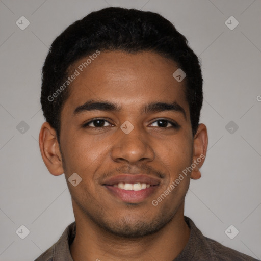 Joyful black young-adult male with short  brown hair and brown eyes