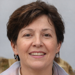 Joyful white adult female with short  brown hair and brown eyes