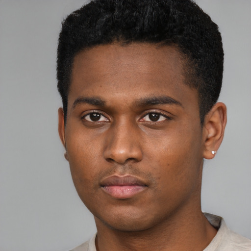 Neutral black young-adult male with short  black hair and brown eyes