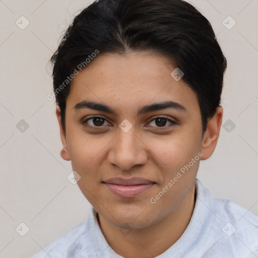 Joyful latino young-adult female with short  brown hair and brown eyes