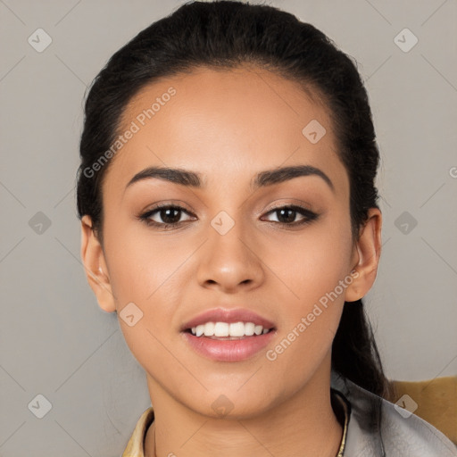 Joyful latino young-adult female with short  black hair and brown eyes