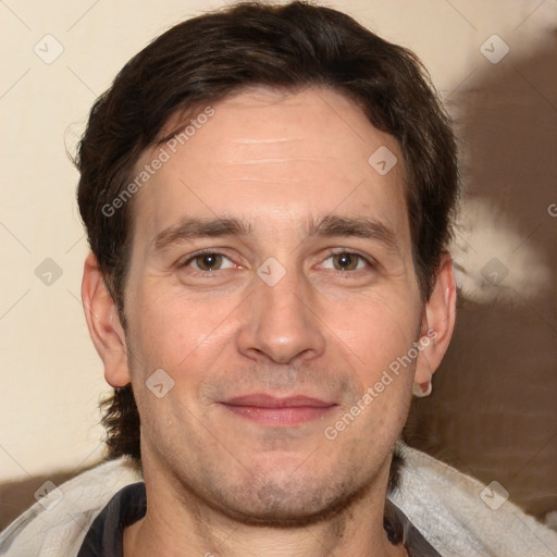 Joyful white adult male with short  brown hair and brown eyes