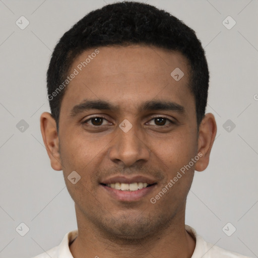 Joyful latino young-adult male with short  black hair and brown eyes