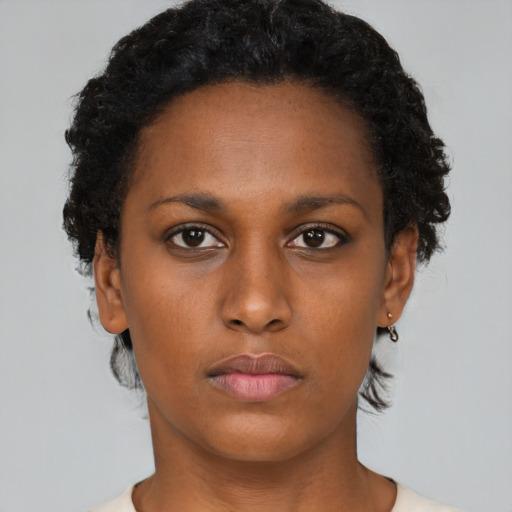 Neutral black young-adult female with short  black hair and brown eyes