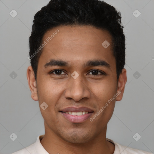 Joyful latino young-adult male with short  black hair and brown eyes