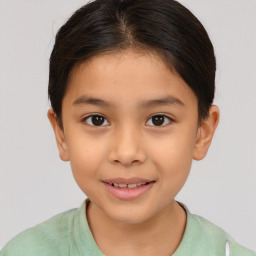 Joyful white child female with short  brown hair and brown eyes