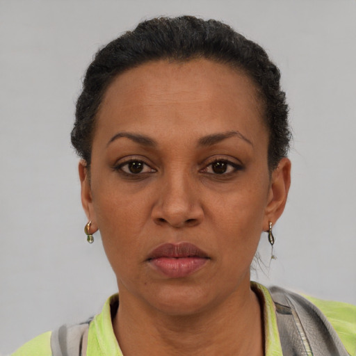 Neutral black adult female with short  brown hair and brown eyes