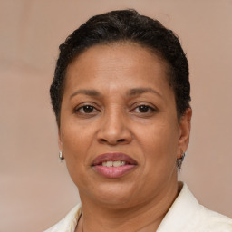 Joyful latino adult female with short  brown hair and brown eyes