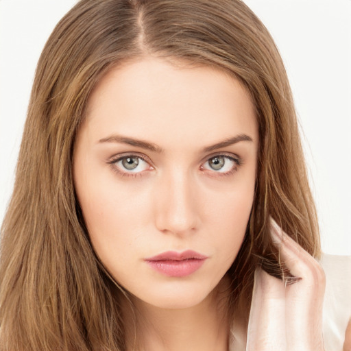 Neutral white young-adult female with long  brown hair and brown eyes