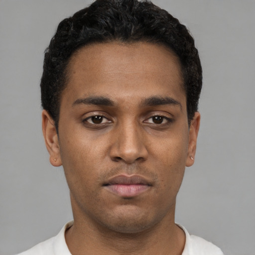 Neutral black young-adult male with short  black hair and brown eyes