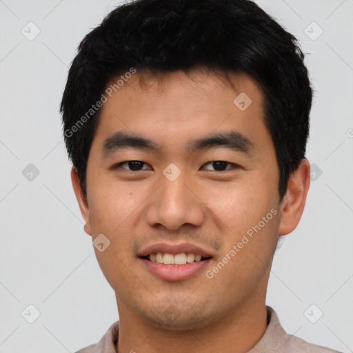 Joyful asian young-adult male with short  black hair and brown eyes