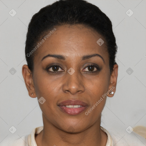 Joyful black young-adult female with short  brown hair and brown eyes