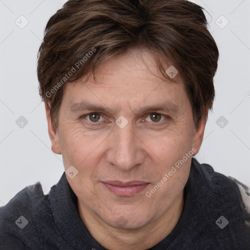 Joyful white adult male with short  brown hair and grey eyes