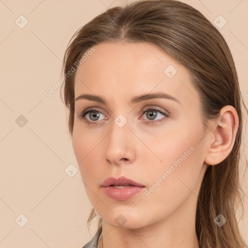 Neutral white young-adult female with long  brown hair and brown eyes