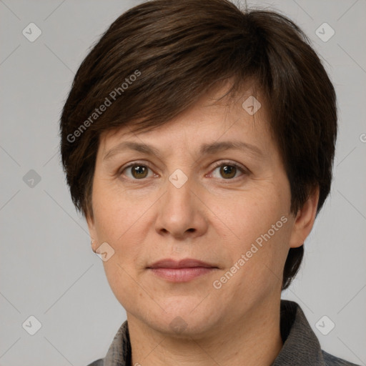 Joyful white adult female with short  brown hair and grey eyes