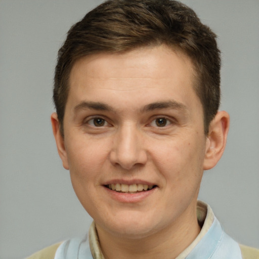 Joyful white adult male with short  brown hair and brown eyes