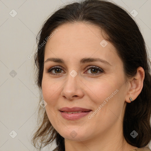 Joyful white adult female with medium  brown hair and brown eyes