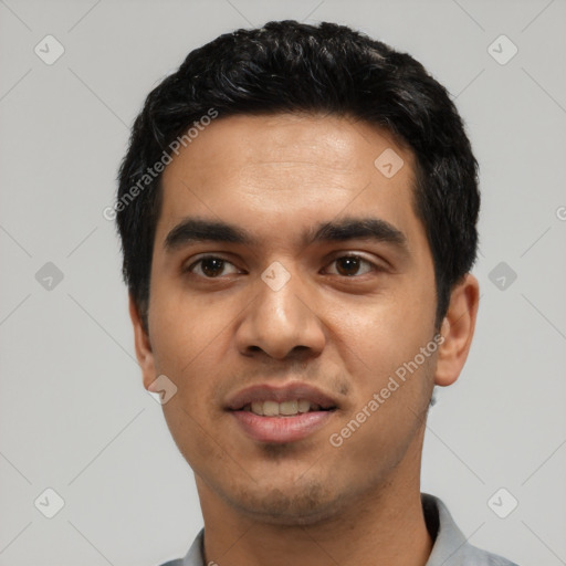 Joyful asian young-adult male with short  black hair and brown eyes