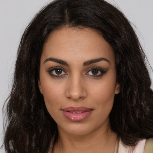 Joyful white young-adult female with long  brown hair and brown eyes