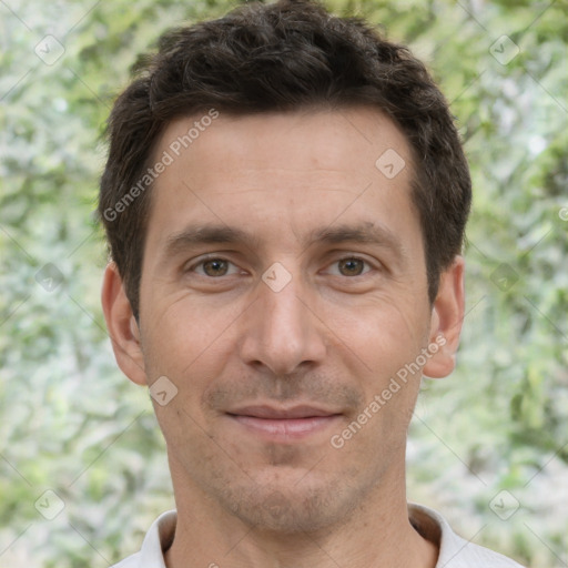 Joyful white adult male with short  brown hair and brown eyes