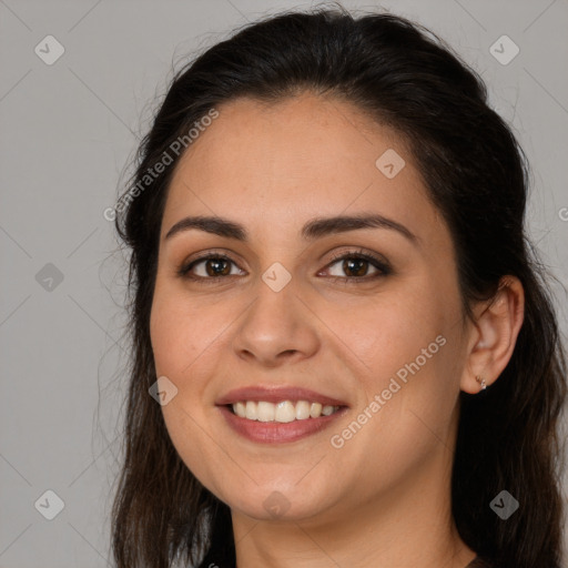 Joyful white young-adult female with long  brown hair and brown eyes