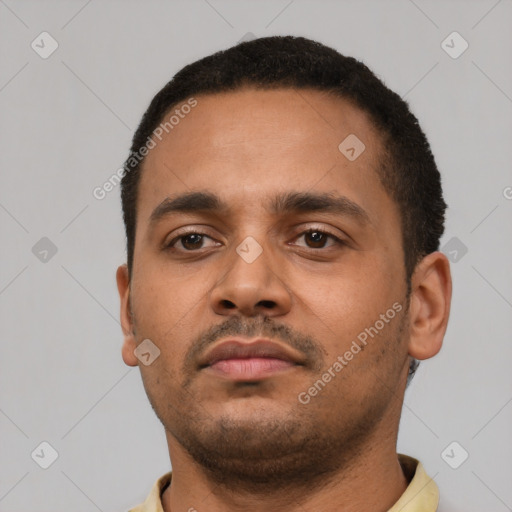 Neutral latino young-adult male with short  black hair and brown eyes