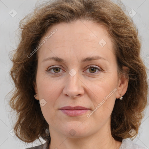 Joyful white adult female with long  brown hair and brown eyes