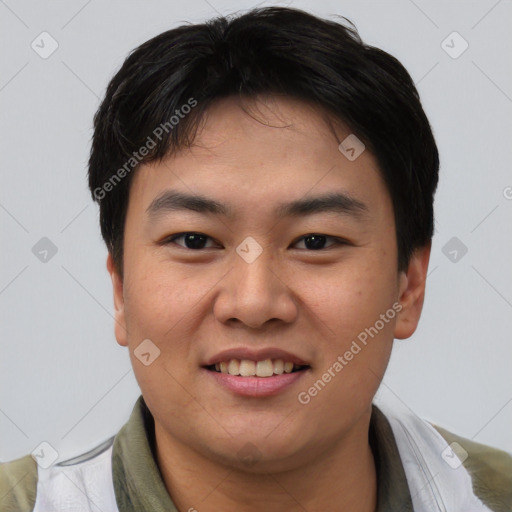 Joyful asian young-adult male with short  black hair and brown eyes