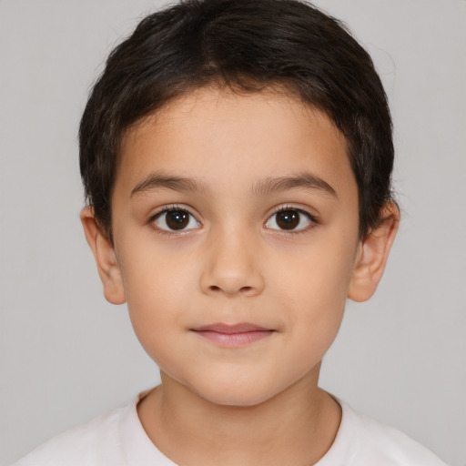 Joyful white child female with short  brown hair and brown eyes