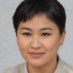 Joyful asian young-adult female with short  brown hair and brown eyes