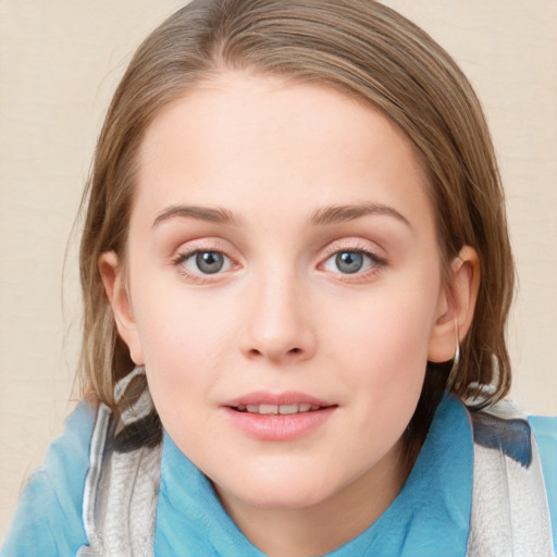 Joyful white child female with medium  brown hair and blue eyes