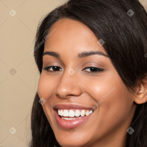 Joyful latino young-adult female with long  brown hair and brown eyes