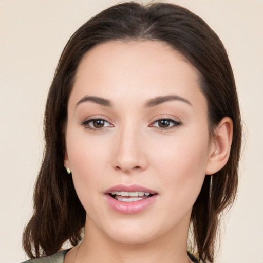 Joyful white young-adult female with medium  brown hair and brown eyes