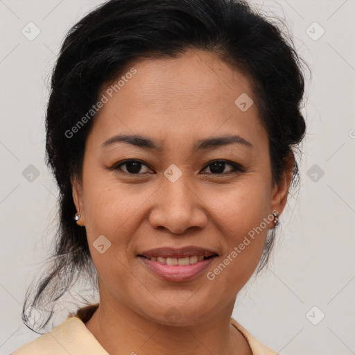 Joyful asian adult female with medium  brown hair and brown eyes