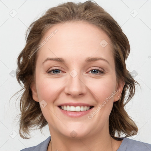 Joyful white young-adult female with medium  brown hair and blue eyes