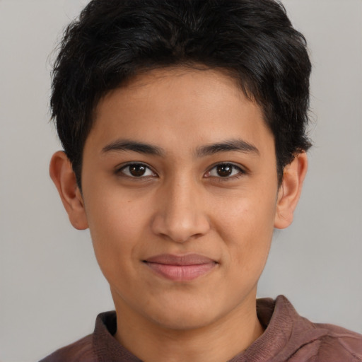 Joyful latino young-adult male with short  brown hair and brown eyes