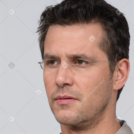 Neutral white adult male with short  brown hair and brown eyes