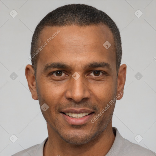 Joyful latino young-adult male with short  brown hair and brown eyes