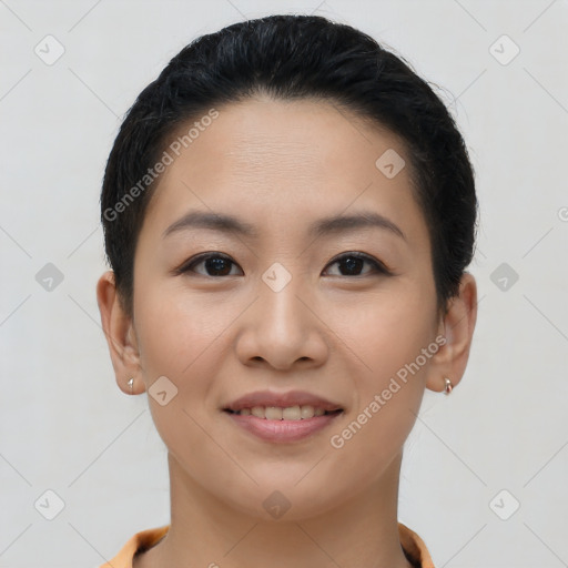 Joyful asian young-adult female with short  brown hair and brown eyes