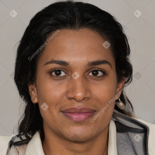 Joyful black adult female with medium  brown hair and brown eyes